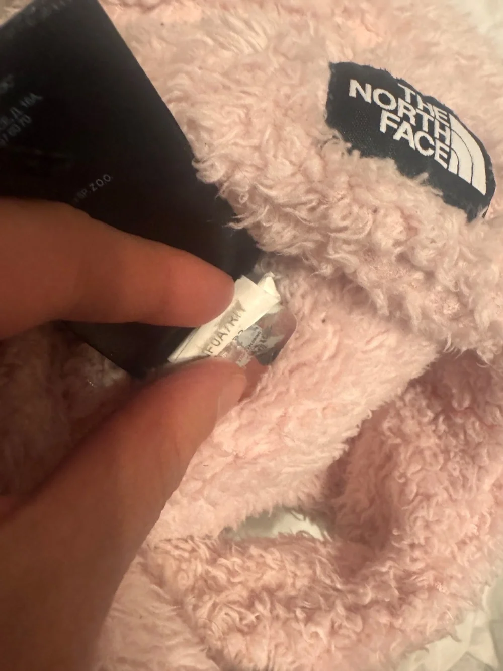 North Face Baby Bear Suave Oso Beanie in pink with a prominently displayed woven